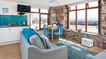 Watch the comings and goings of the harbour from the comfortable sitting room.