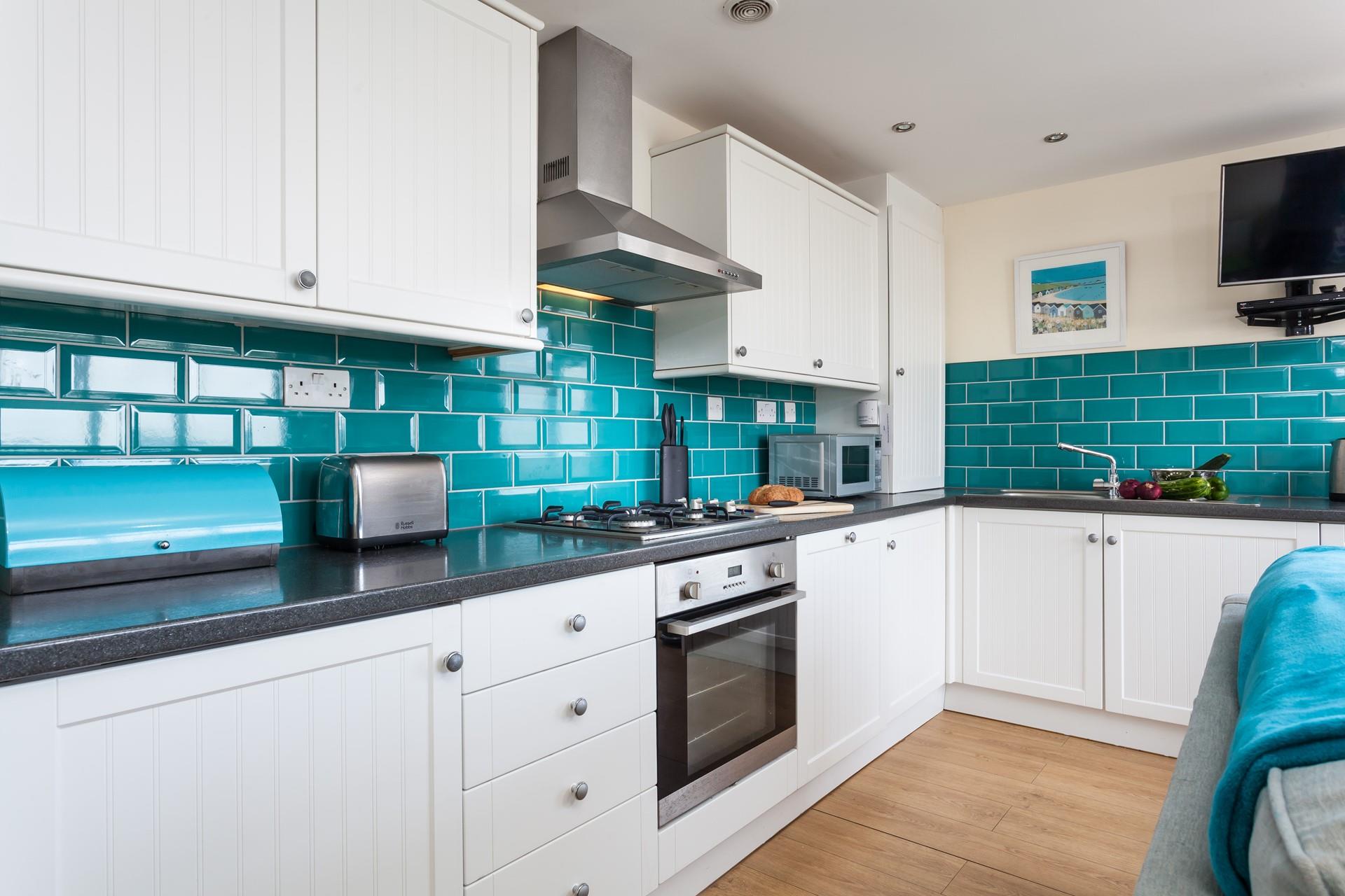The kitchen has plenty of worktop space to prepare meals and picnics.