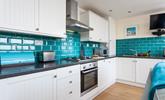 The kitchen has plenty of worktop space to prepare meals and picnics. - Thumbnail Image