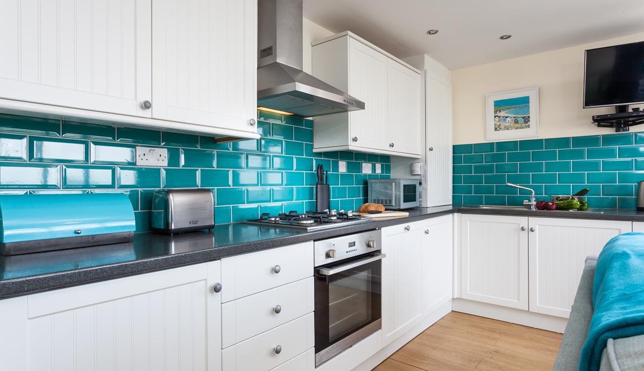 The kitchen has plenty of worktop space to prepare meals and picnics.
