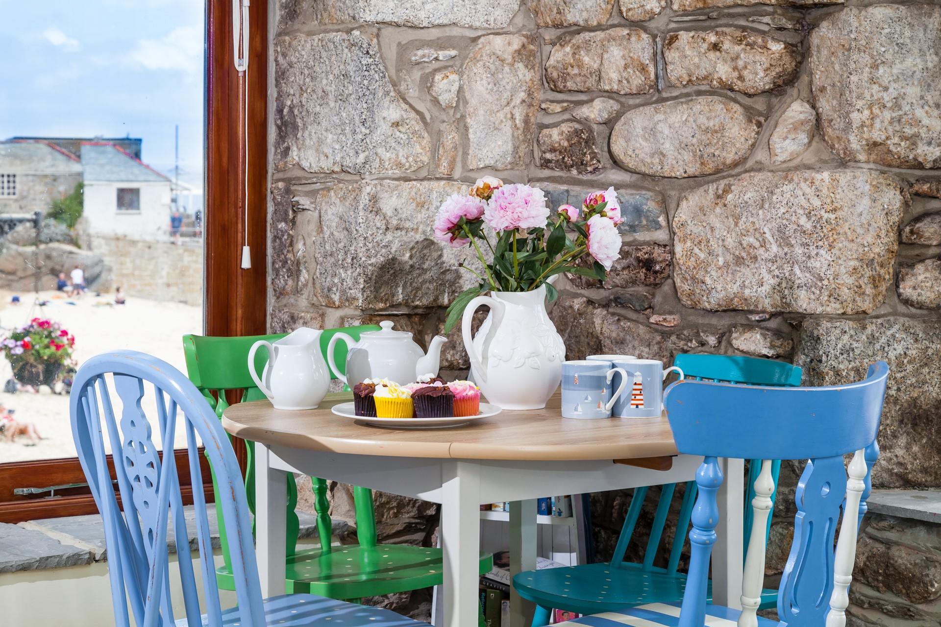 Enjoy a pot of afternoon tea and fluffy cupcakes with the beach backdrop.
