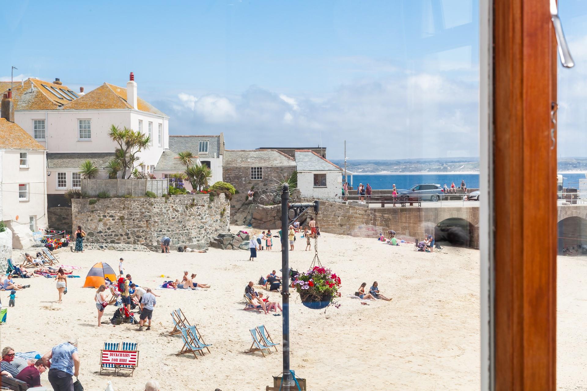 Step out the door onto the cobbled streets to spend the day on the beach.