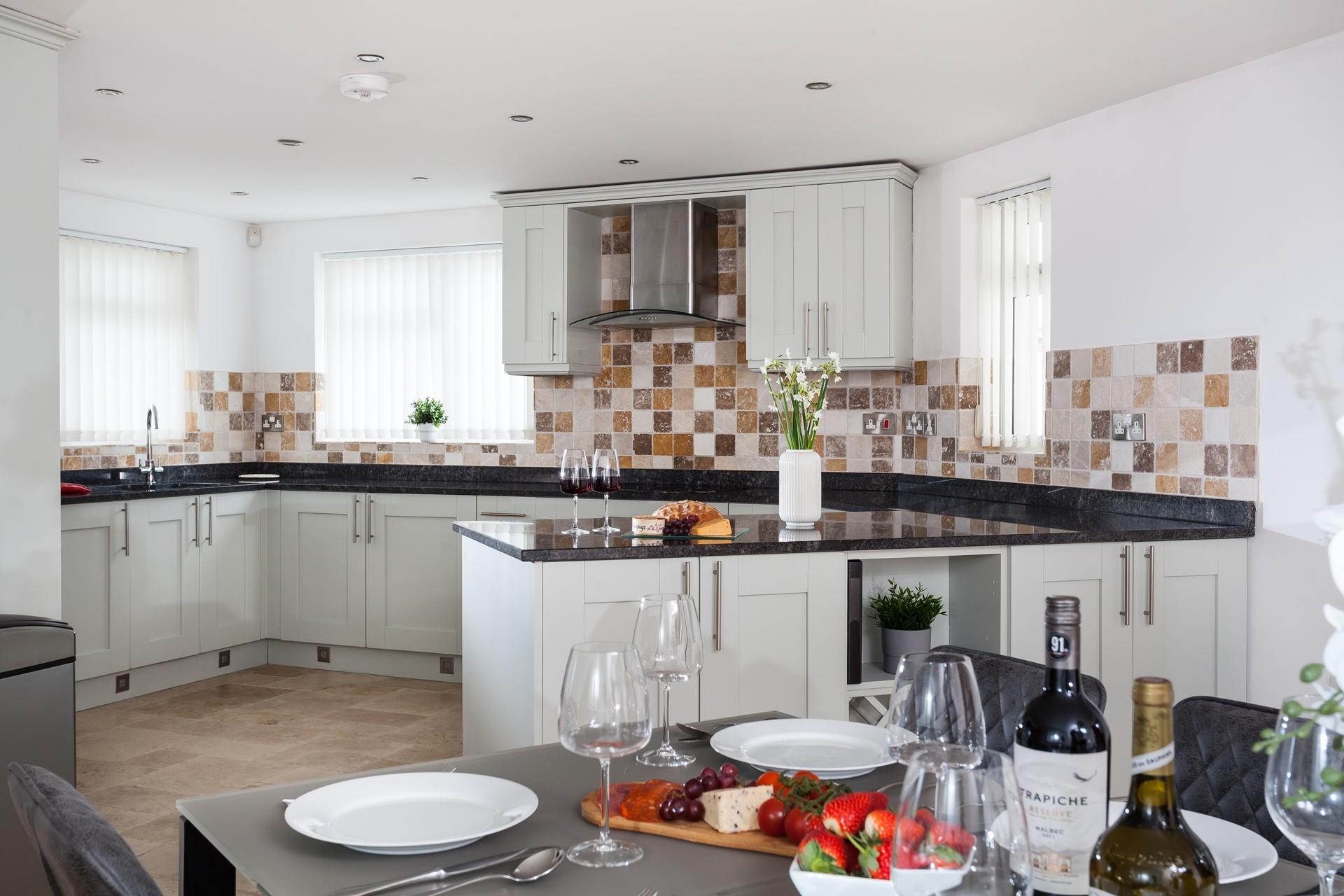 The kitchen is spacious and perfectly equipped for all your cooking needs.