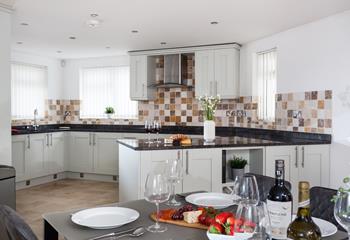 The kitchen is spacious and perfectly equipped for all your cooking needs.