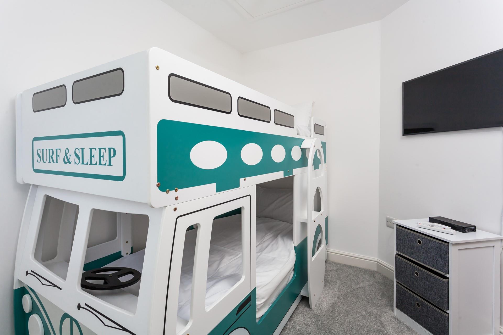 Tuck the kids into the fun camper van bunk beds after a busy day on the beach.