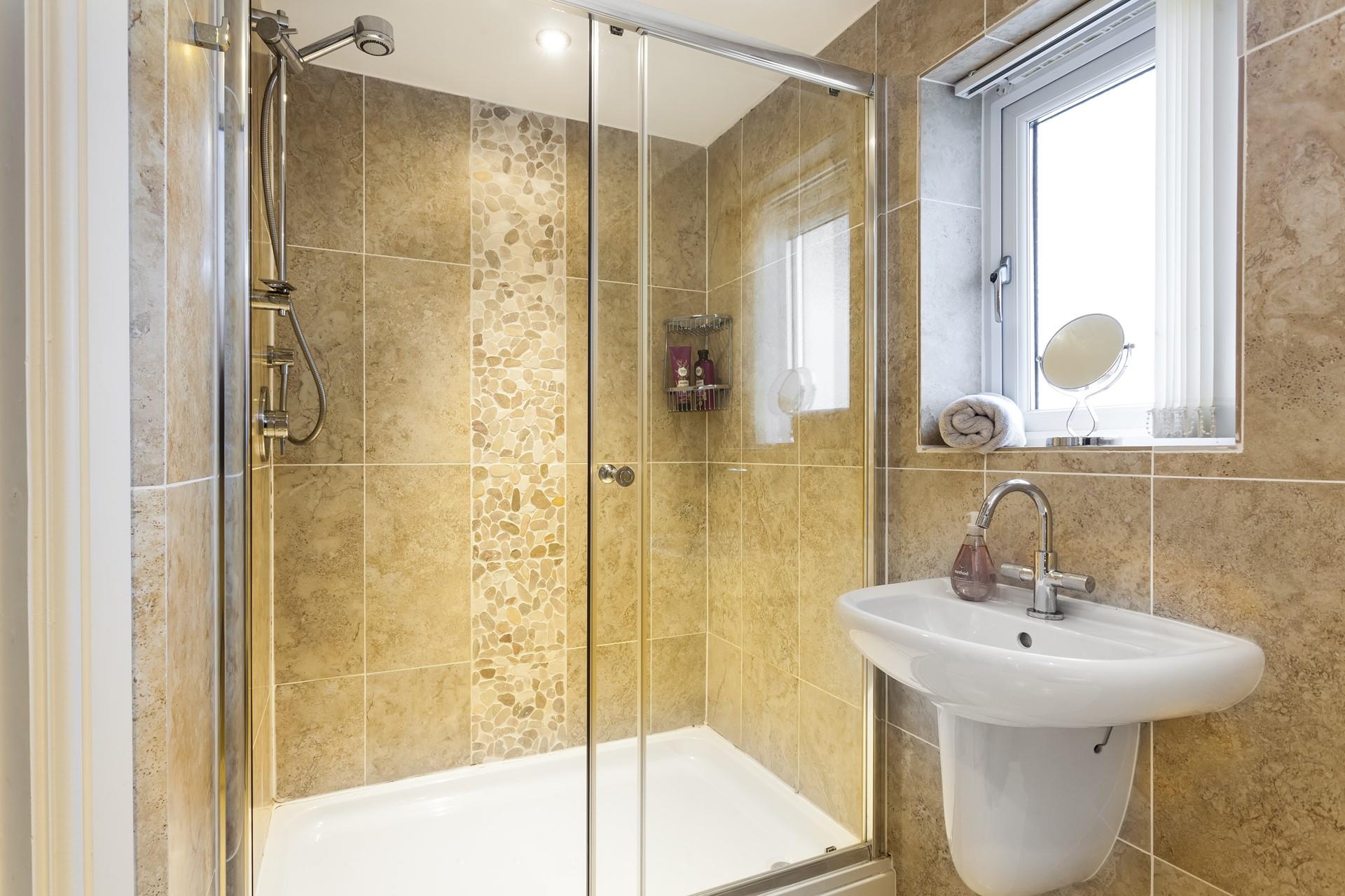 Wash off sandy toes in the shower after a day spent on Porthmeor beach.