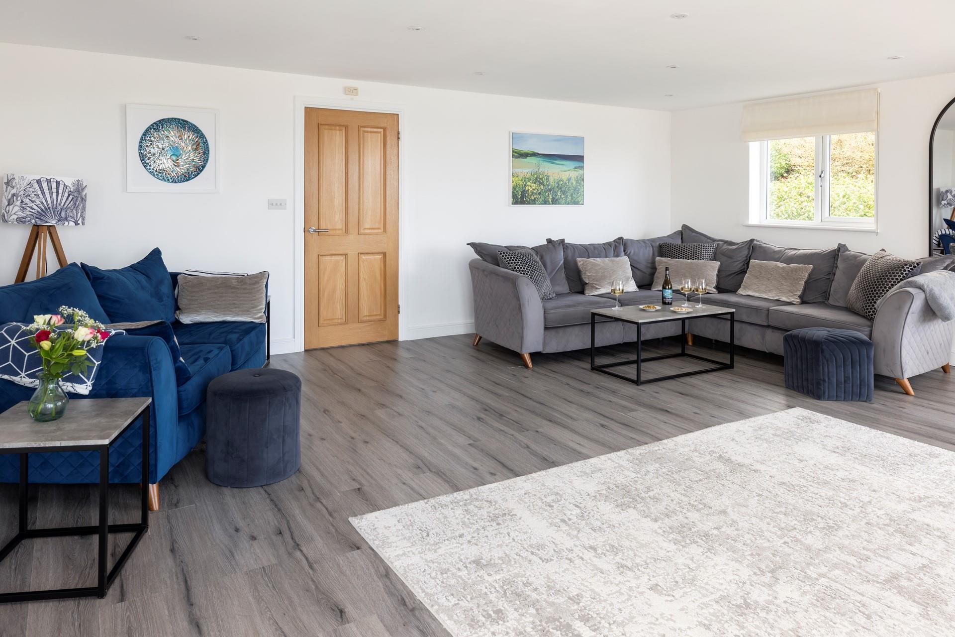 The large sitting room is perfect to spend quality time together, catching up over a glass of your favourite wine.