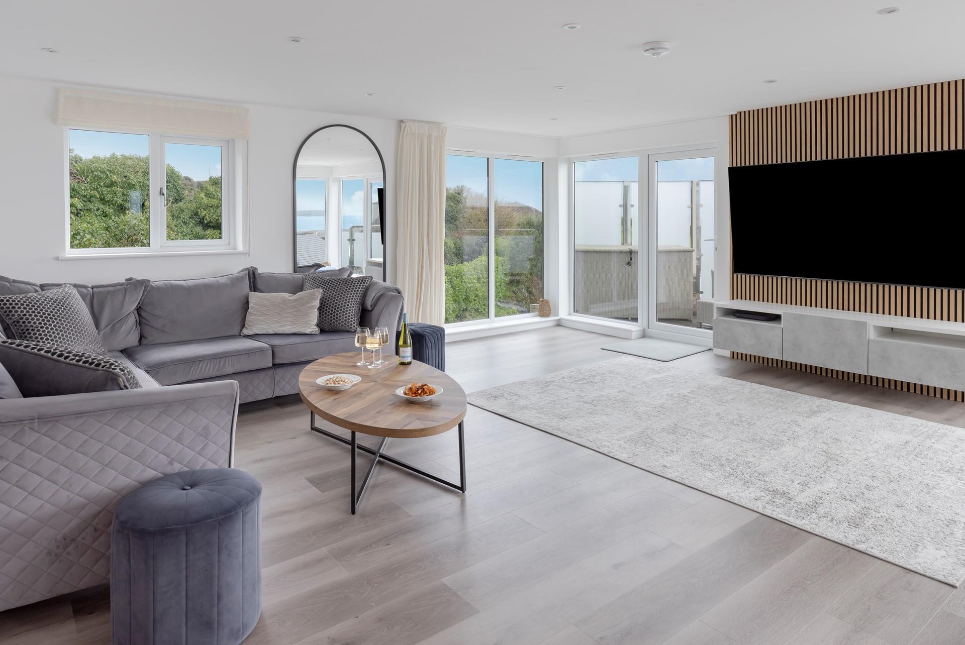 The large sitting room is perfect to spend quality time together, catching up over a glass of your favourite wine.