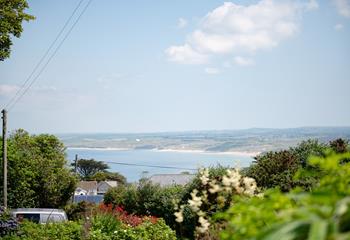 Soak up the peace and tranquillity in your garden and look out to stunning sea views.