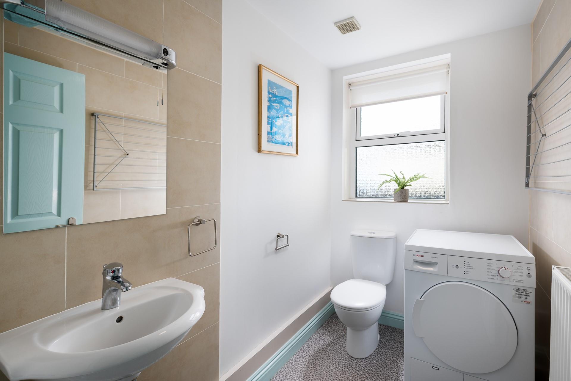 The property benefits from a separate cloakroom, perfect for sorting out your beach gear!
