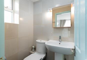 The en suite benefits from a double shower, giving guests plenty of space to get ready for the day ahead.