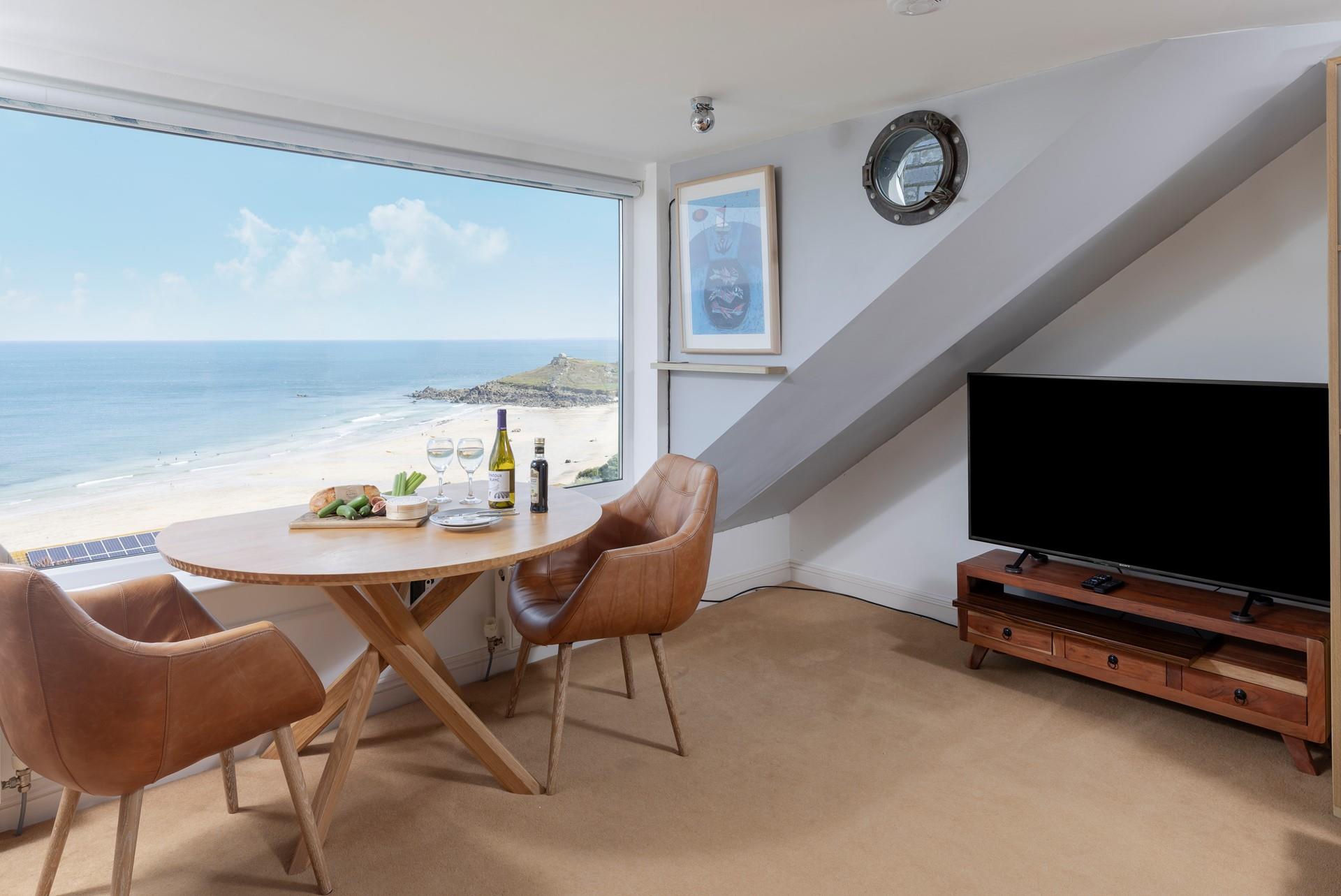 Enjoy holiday meals with the sea stretching endlessly beyond.