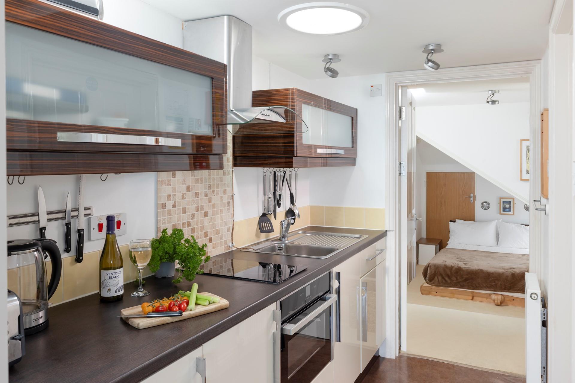 Modern and compact, the kitchen has all you need for a relaxing stay.