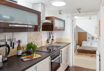 Modern and compact, the kitchen has all you need for a relaxing stay.