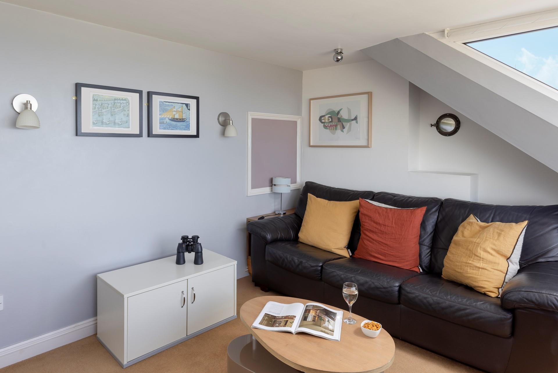 Curl up on the comfortable sofa after a day of rambling along the coast path.