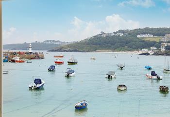 Watch the boats bobbing in the harbour each day.