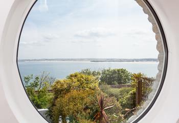 A porthole window really captures the magic of a seaside holiday!