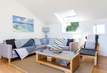 The cosy sitting room offers ample space for the whole family to come together and enjoy quality time with one another.