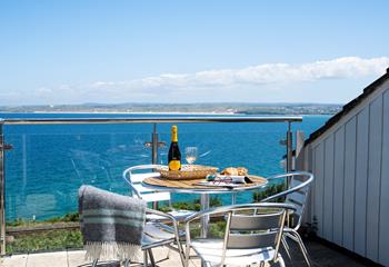 Enjoy these mesmerising sea views with some nibbles and a glass of something chilled in hand.
