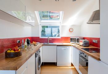 Stylish and filled with modern appliances, the kitchen is ideal for whipping up delicious home-cooked meals.