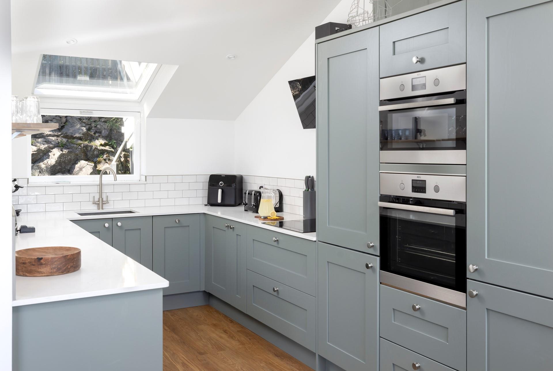 Stylish and filled with modern appliances, the kitchen is ideal for whipping up delicious home-cooked meals.