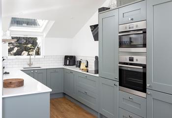 Stylish and filled with modern appliances, the kitchen is ideal for whipping up delicious home-cooked meals.