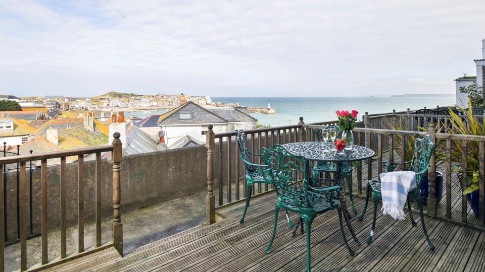 The charming terrace benefits from breathtaking views of the harbour, perfect for enjoying a glass of something chilled.