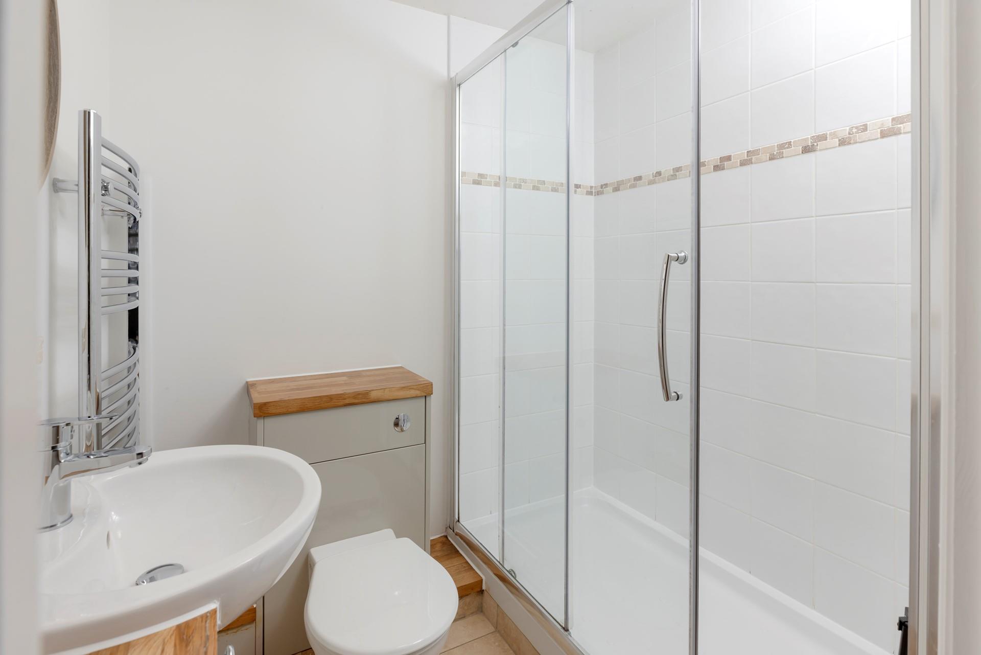 Wash off sandy toes in the shower after spending the day on the beach.