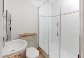 Wash off sandy toes in the shower after spending the day on the beach.