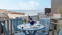 Sink into relaxation mode as you sip a cold beverage on the balcony.