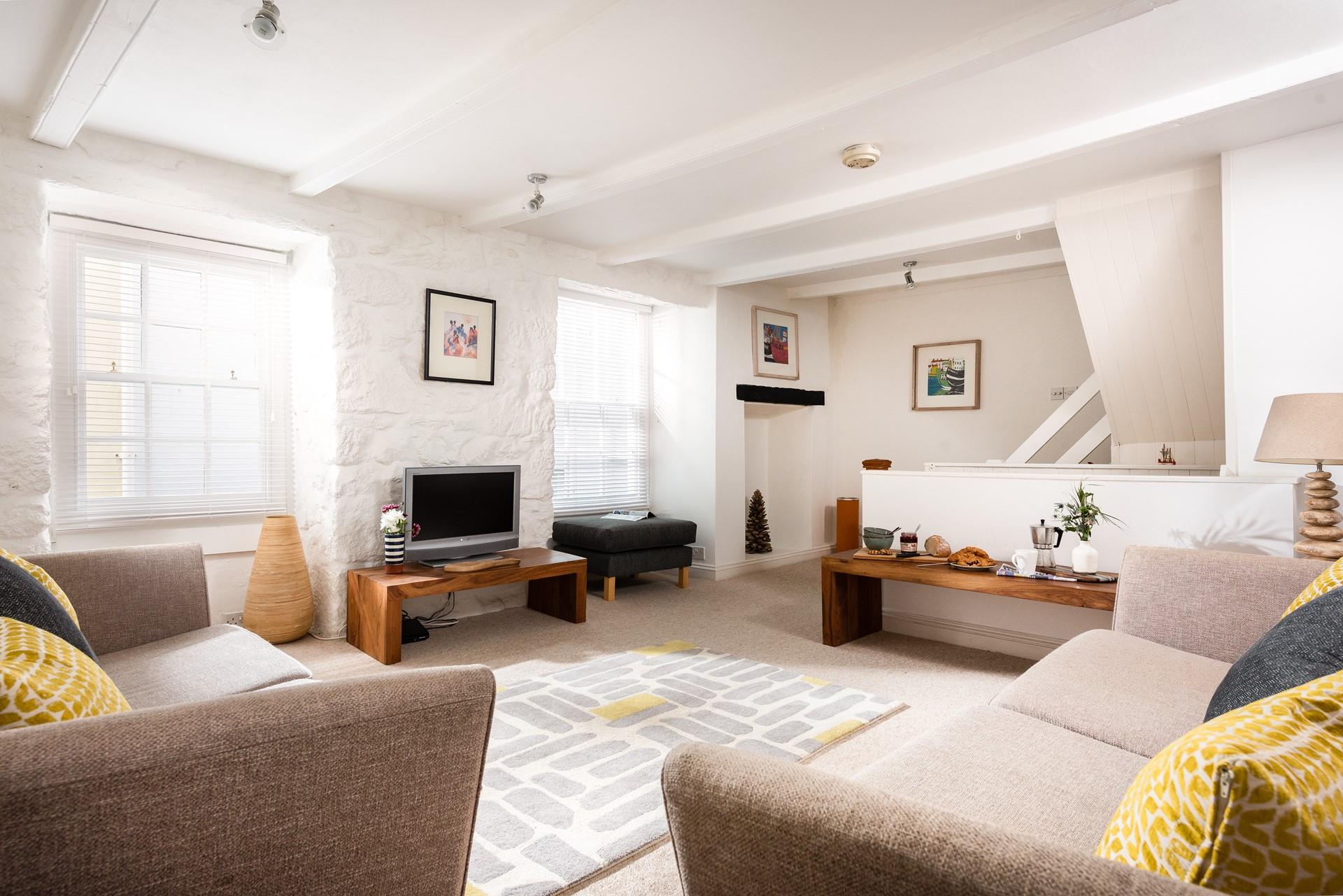 The large sitting area has bedrooms leading off and provides a cosy base in the evenings.
