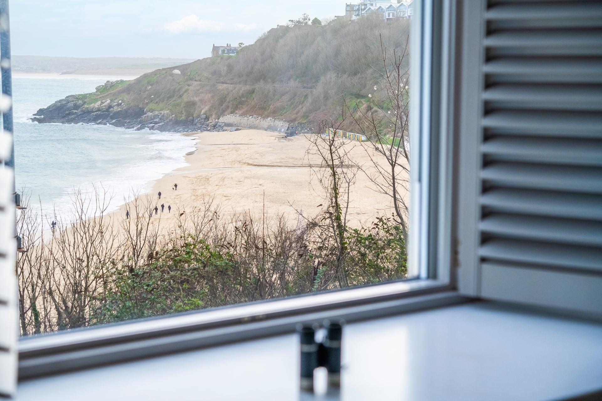 Watch the waves roll onto shore on Porthminster beach.