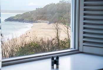 Watch the waves roll onto shore on Porthminster beach.