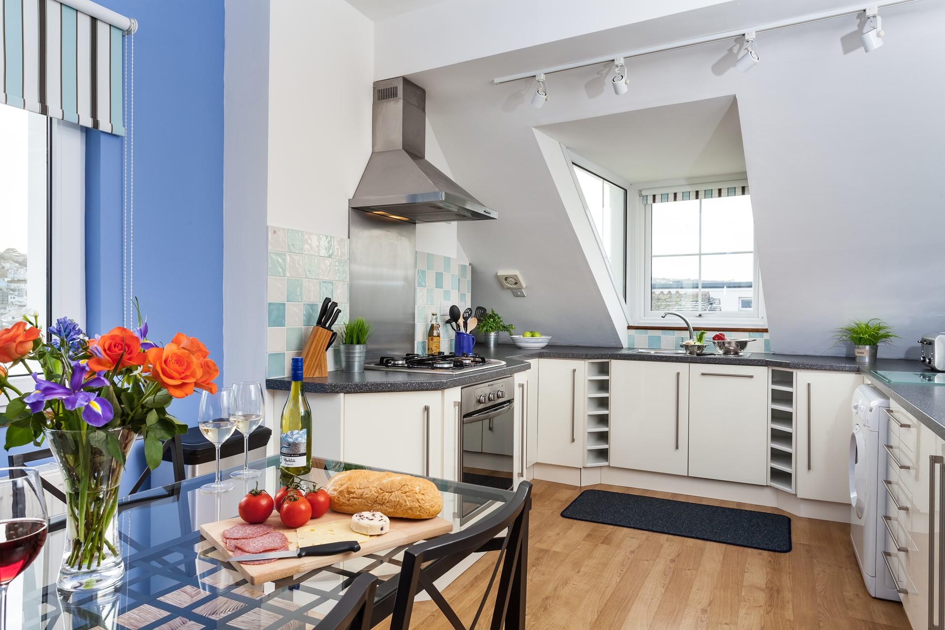 Thoughtfully designed to maximise space, the kitchen is fully equipped with modern appliances to make cooking a breeze.