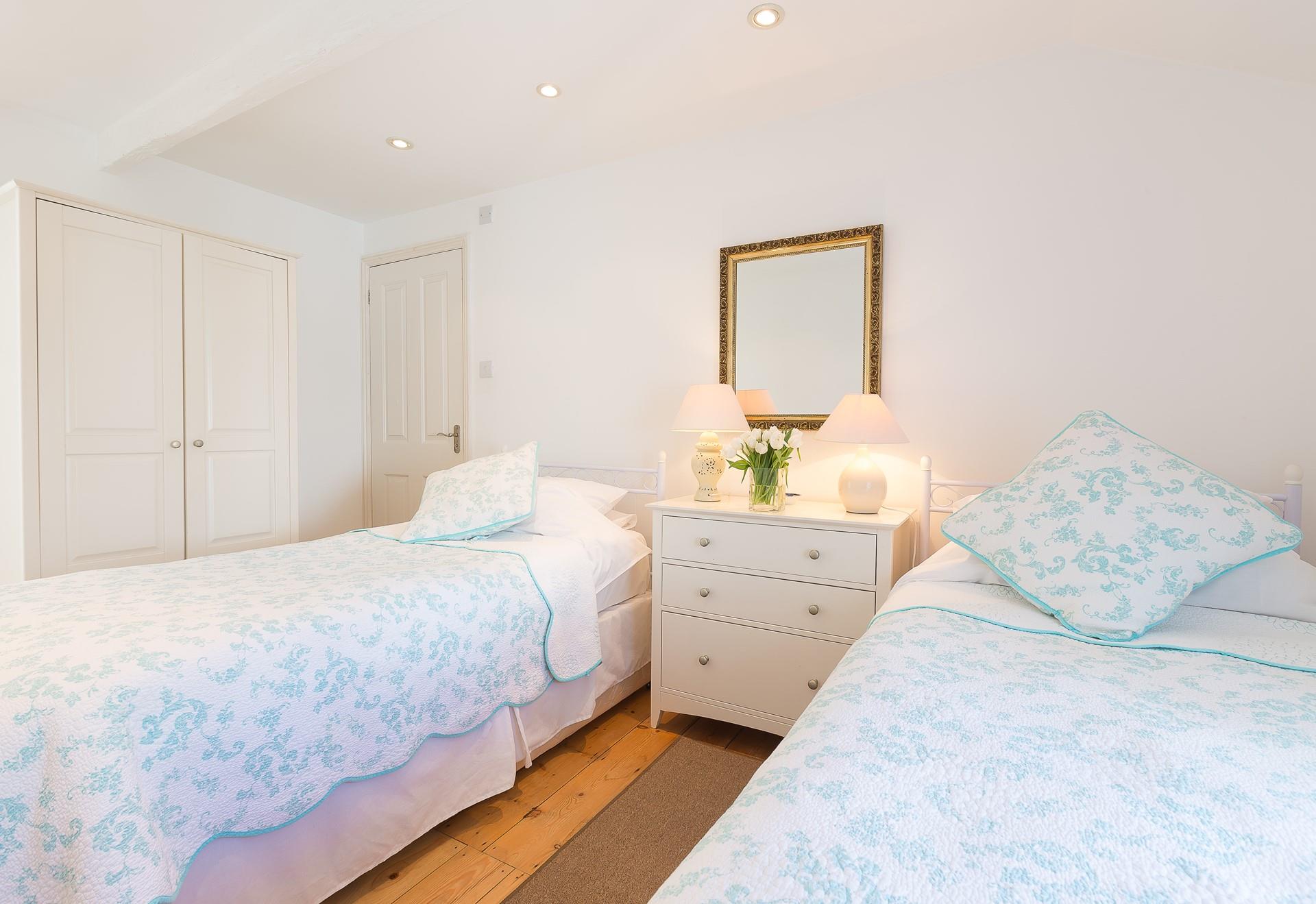 Bedroom 2 has twin beds, perfect for the little ones to sleep the night away exhausted from beach days.