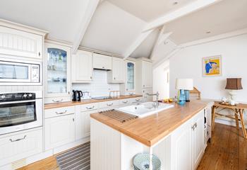 Well-equipped open plan kitchen with Island sink unit.