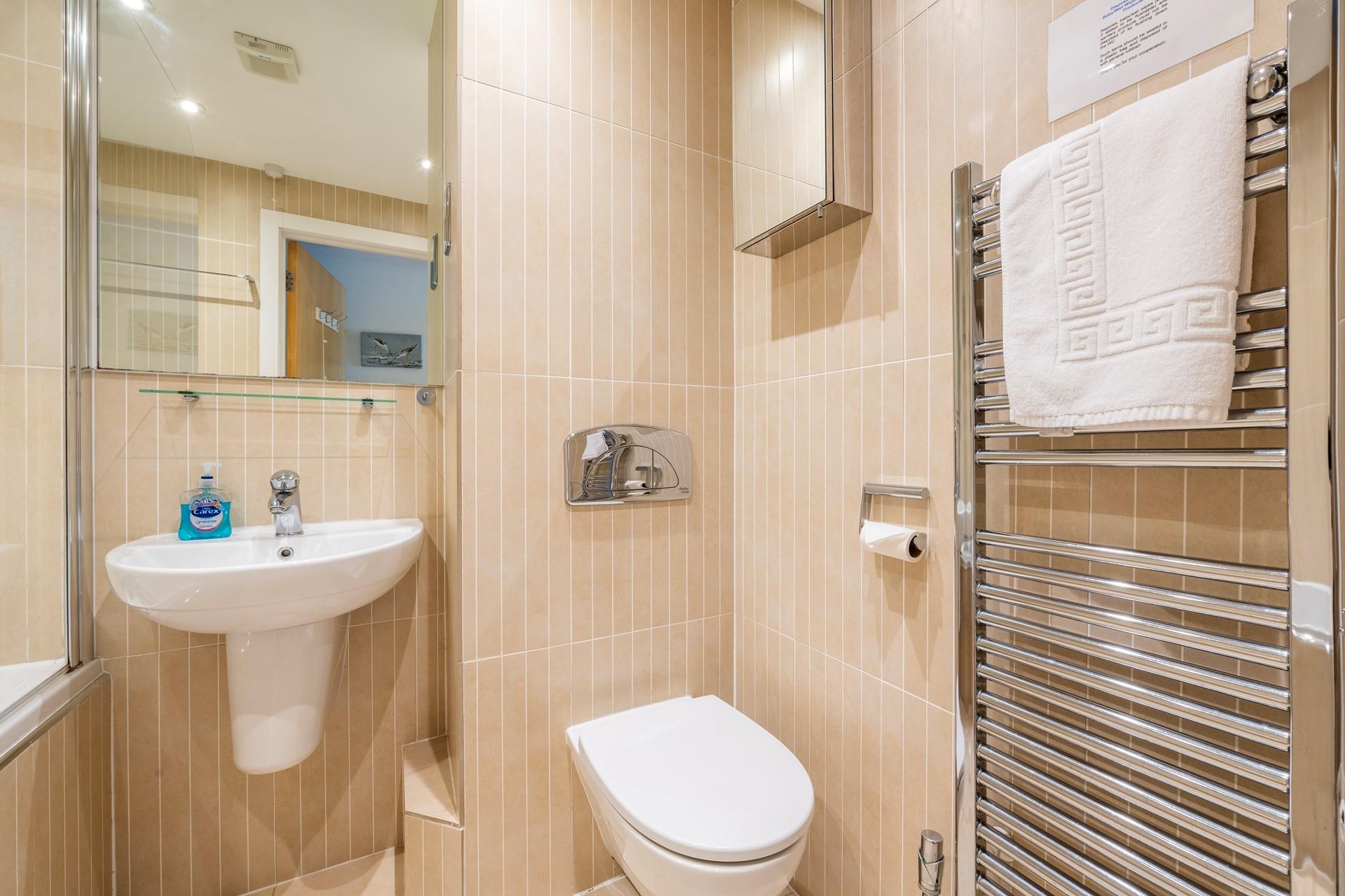 Spend evenings relaxing in your tub with a glass of wine in hand.