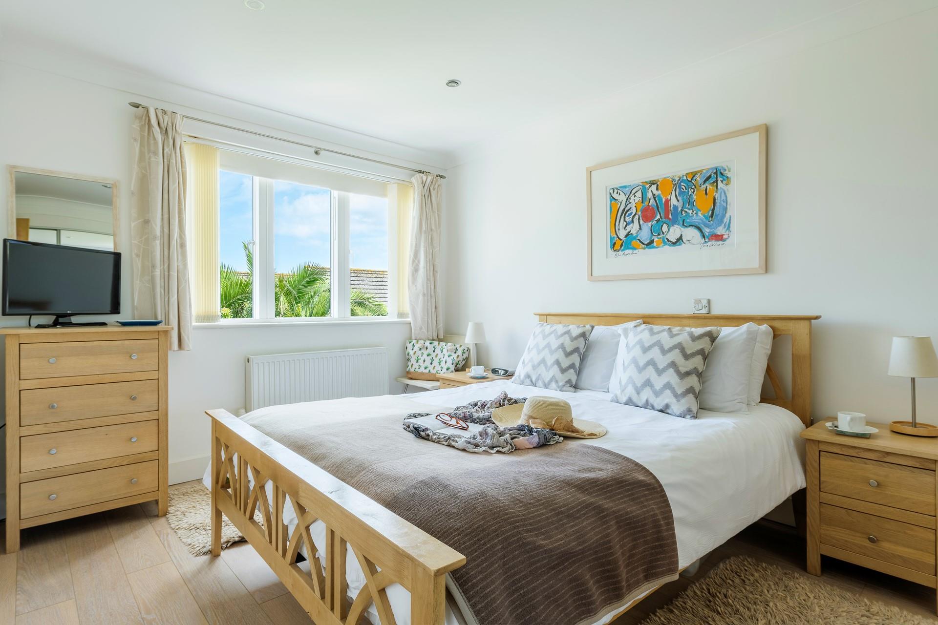 Wake up from a comfortable night's sleep and plan your day from your cosy king size bed.