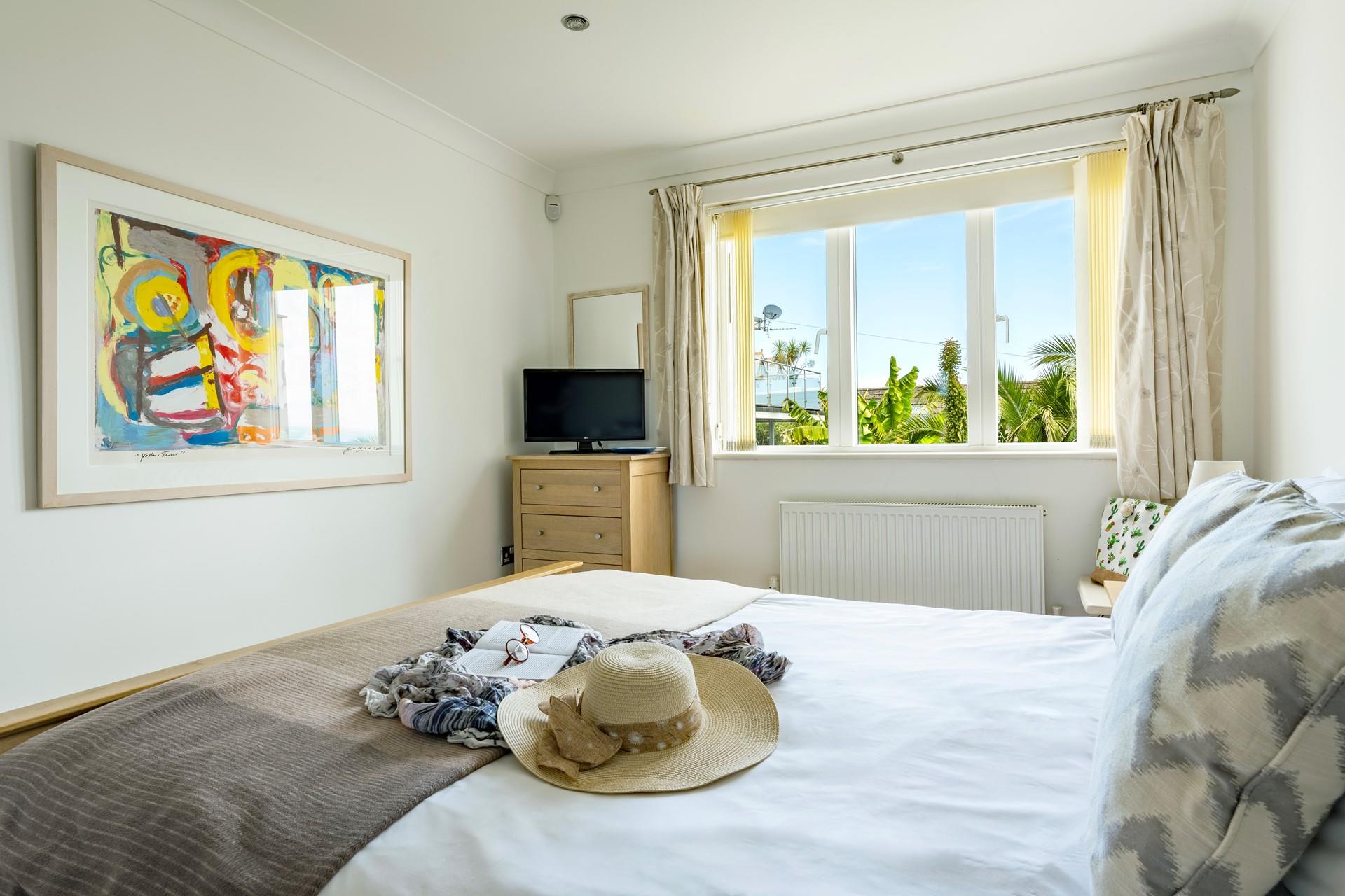 Wake up and glimpse out at the sea as you open your curtains.