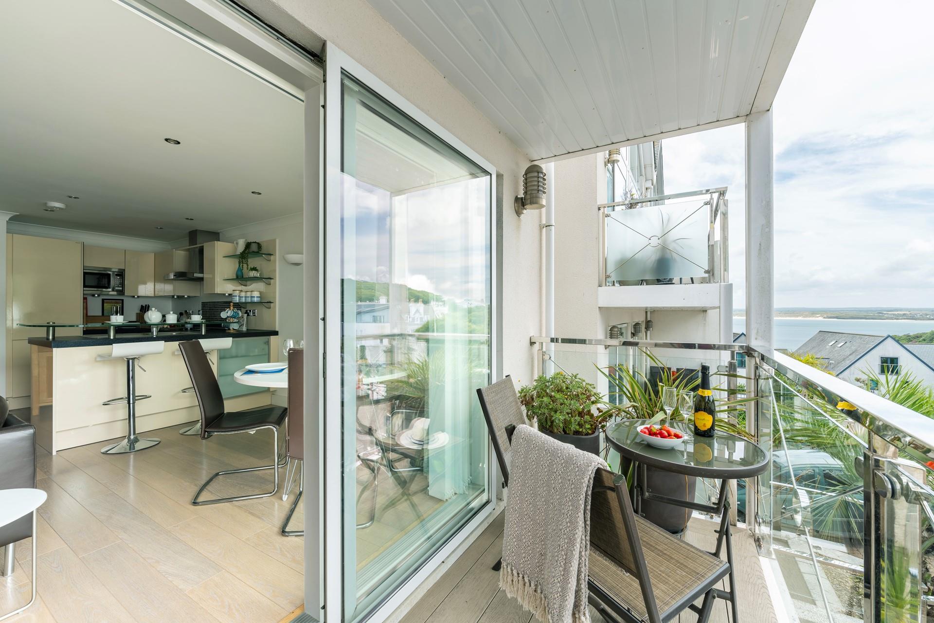 Buy a new wine to try from a local shop in time and sip it on your balcony watching the sun come down.