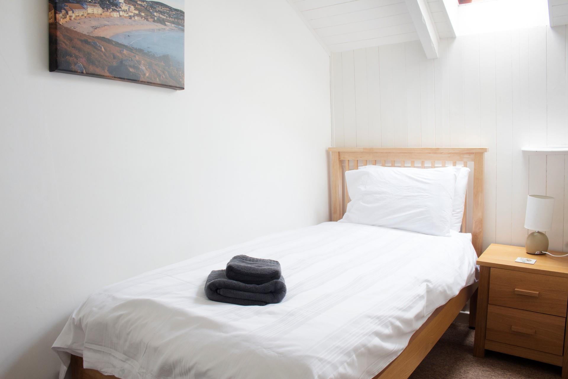 Tuck into the cosy single bed at the end of a busy beach day.