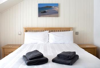 Crisp white linen invites you to snuggle down after a busy day exploring St Ives.