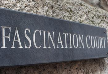 A traditional local slate sign is the perfect medium and looks great against the traditional granite stone face wall.