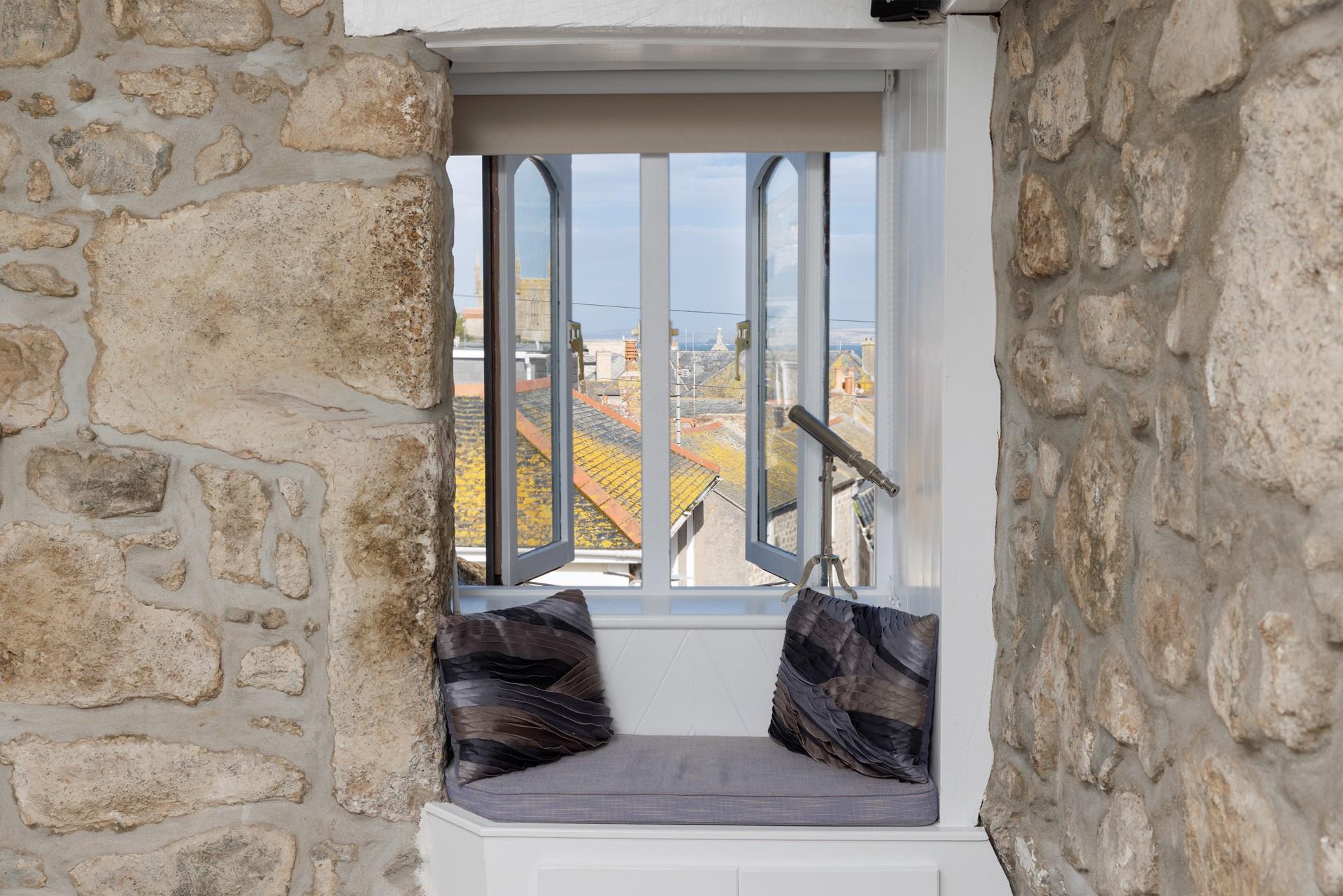 Enjoy the sea views over the rooftops.