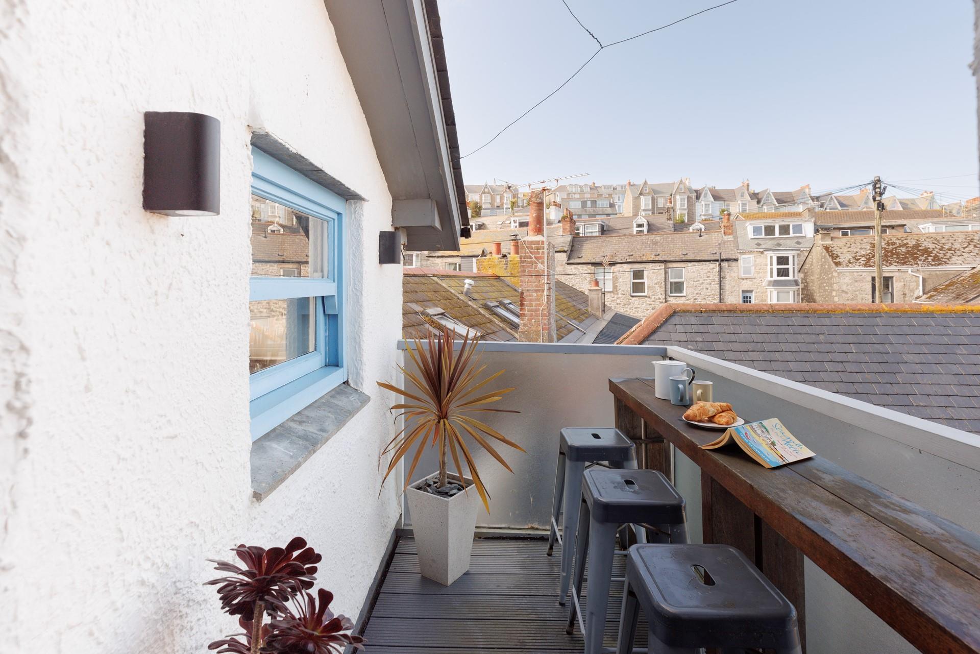 Enjoy a cuppa from the roof terrace area, with a sea view across the roof tops.