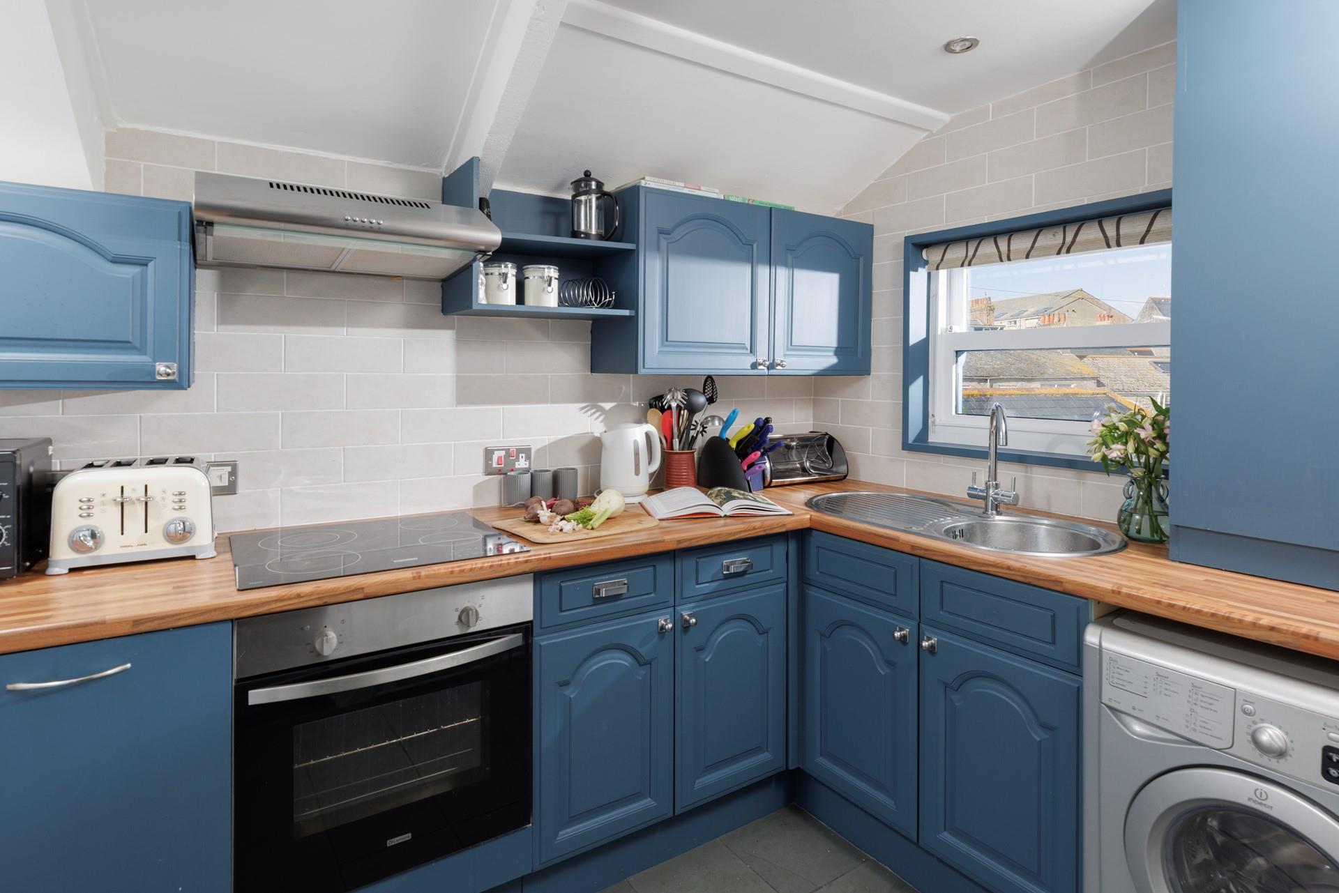 You will find the seaside-themed kitchen well-equipped with everything you need to whip up delicious meals.