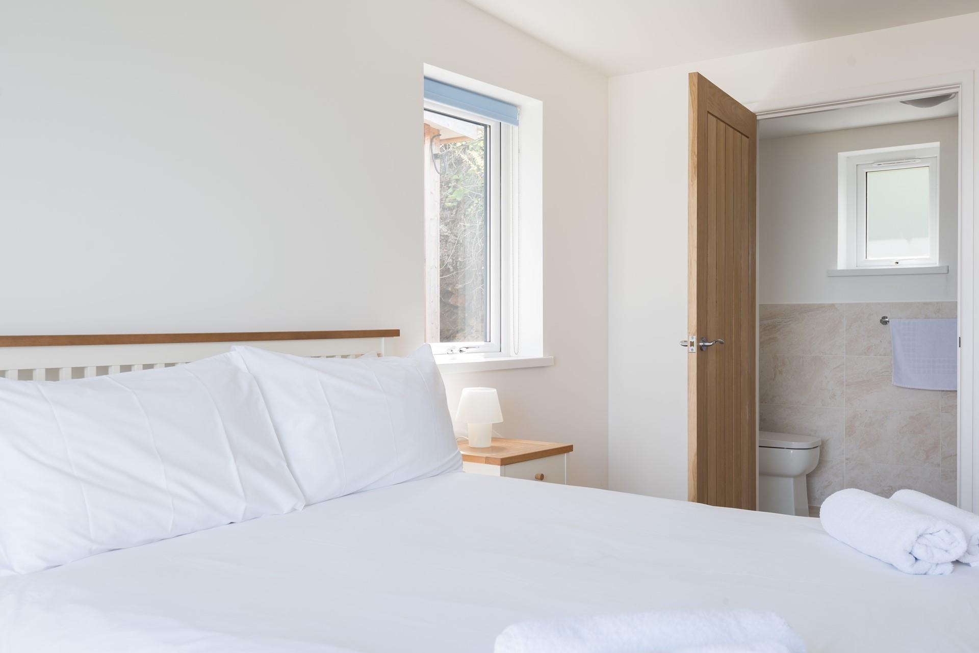 Bedroom 1 benefits from an en suite shower room. 