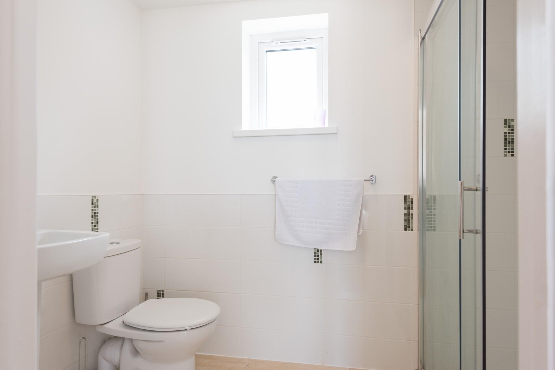 The en suite shower room in bedroom 1 has a large enclosed shower.