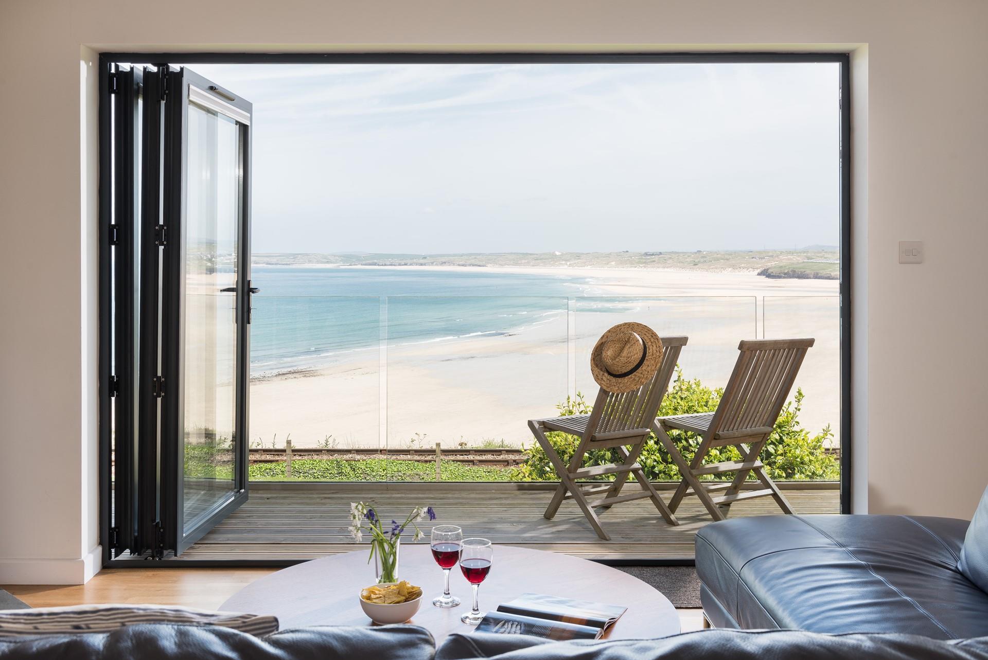 Open the bi-fold doors and enjoy the uninterrupted, picture-perfect view across Hayle and Godrevy.