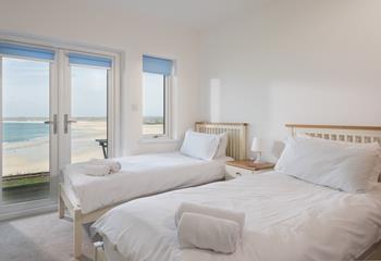 The twin room has patio doors leading onto the glass-fronted balcony, the perfect viewing point. 